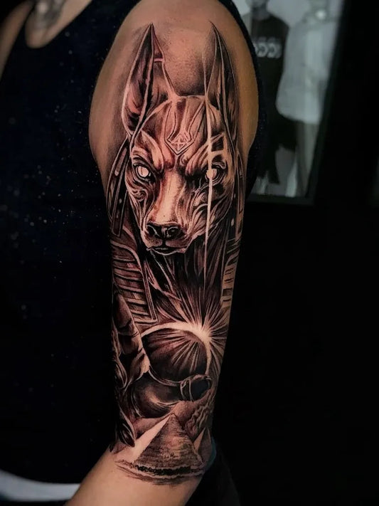 Big Black and Grey Anubis Skull Pyramid Tattoo on Women Shoulder by @northtattoosabadell