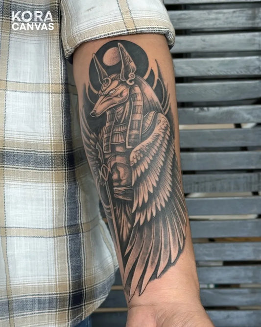 Big Black and Grey Anubis Wings Tattoo on Men Arm by @koracanvastattoo
