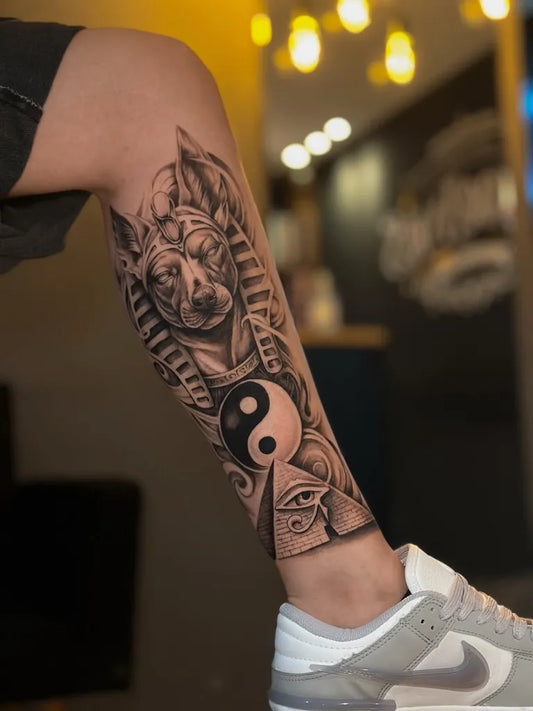 Big Black and Grey Anubis Yin Yang Eye of Horus Tattoo on Men Leg by @guiotaviotattoo