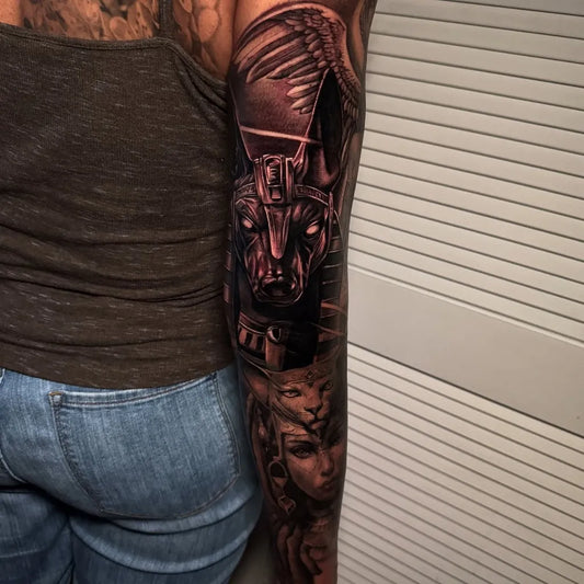 Big Black and Grey Anubis and Egyptian Goddess Tattoo on Women Arm by @dartist04