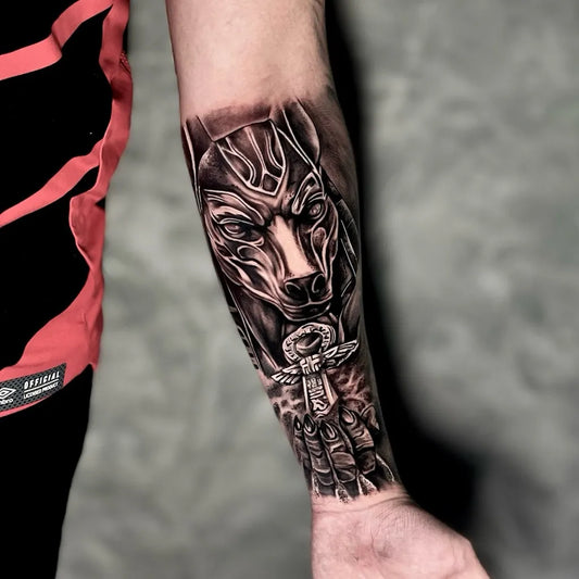 Big Black and Grey Anubis with Ankh Tattoo on Men Arm by @thiagohenriiquetattoo