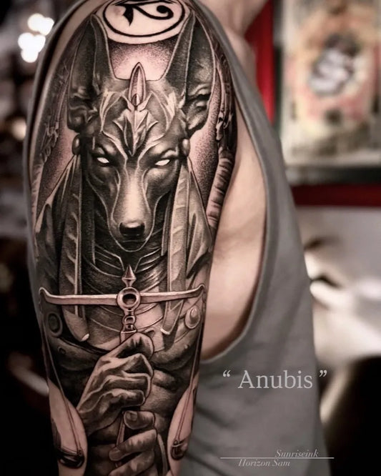 Big Black and Grey Anubis with Ankh and Was Scepter Tattoo on Men Arm by @horizon_sam