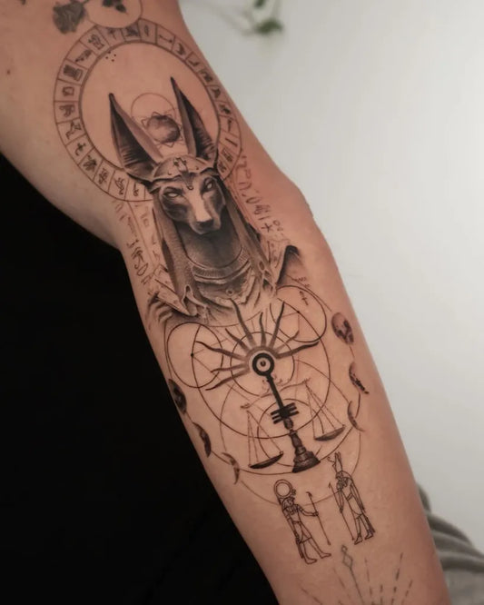 Big Black and Grey Anubis with Egyptian Mandala Tattoo on Men Arm by @cissaspoerltattooartistry