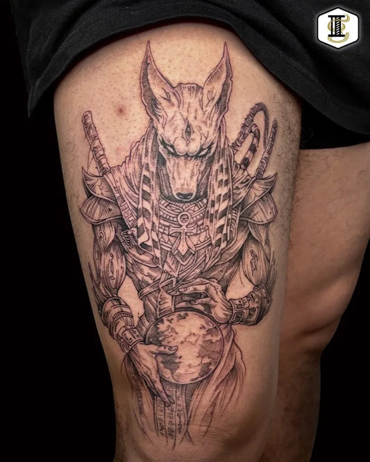 Big Black and Grey Anubis with Globe and Swords Tattoo on Men Thigh by @inkgeniumtattoo