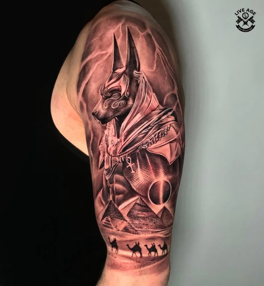 Big Black and Grey Anubis with Pyramids Tattoo on Men Shoulder by @liveage_sad