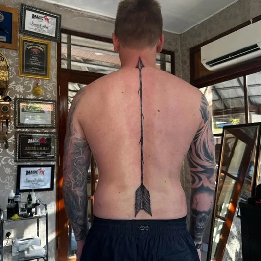 Big Black and Grey Arrow Tattoo on Men Back by @kenyoz_sudama