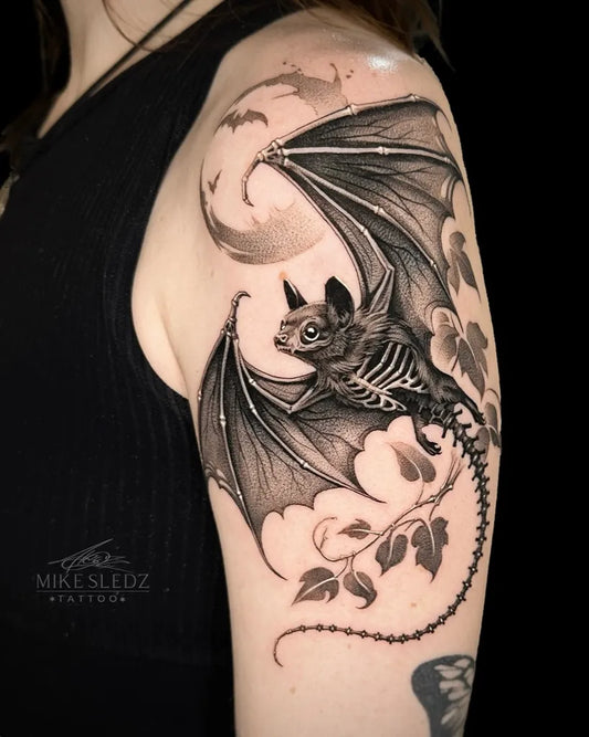Big Black and Grey Bat Skeleton with Vines Tattoo on Women Shoulder by @mikesledz