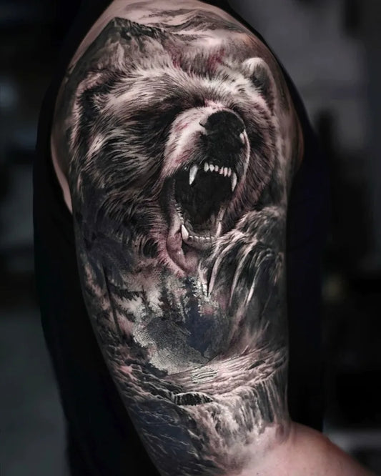 Big Black and Grey Bear in Forest on Men Arm Tattoo by @cado__tt