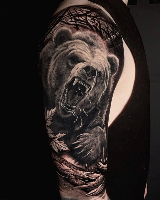 Big Black and Grey Bear with Trees and Leaves on Men Arm Tattoo by @dani_moreno_garcia