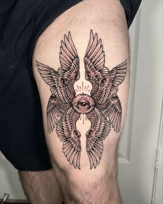 Big Black and Grey Biblically Accurate Angel Wings with Eye on Men Thigh Tattoo by @fairyringstattoos