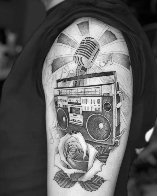 Big Black and Grey Boombox Microphone Rose Music Tattoo on Men Arm by @wisekidtattoo