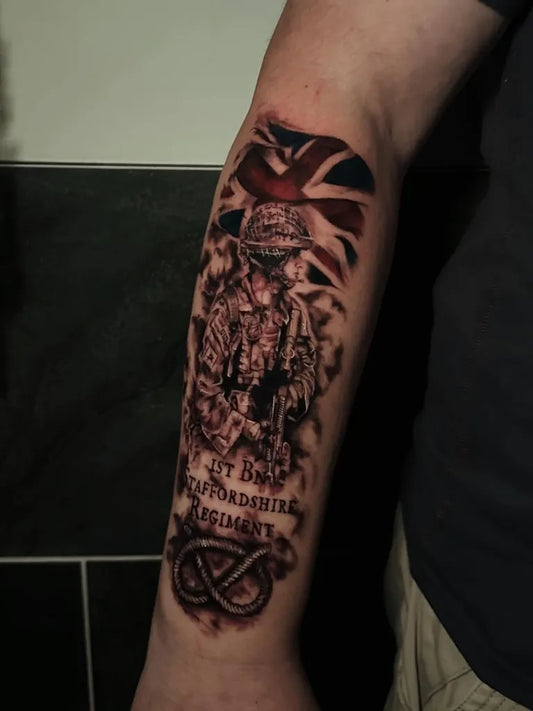 Big Black and Grey British Soldier with Union Jack and Infantry Regiment Military Tattoo on Men Arm by @mnktlw