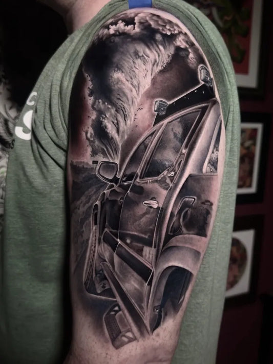 Big Black and Grey Car on Beach Road Tattoo on Men Shoulder by @tattoodraven95