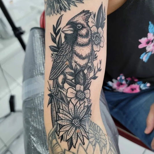 Big Black and Grey Cardinal and Flowers Tattoo on Women Arm by @tattoofiesta