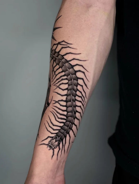 Big Black and Grey Centipede Tattoo on Men Arm by @tatts.mo