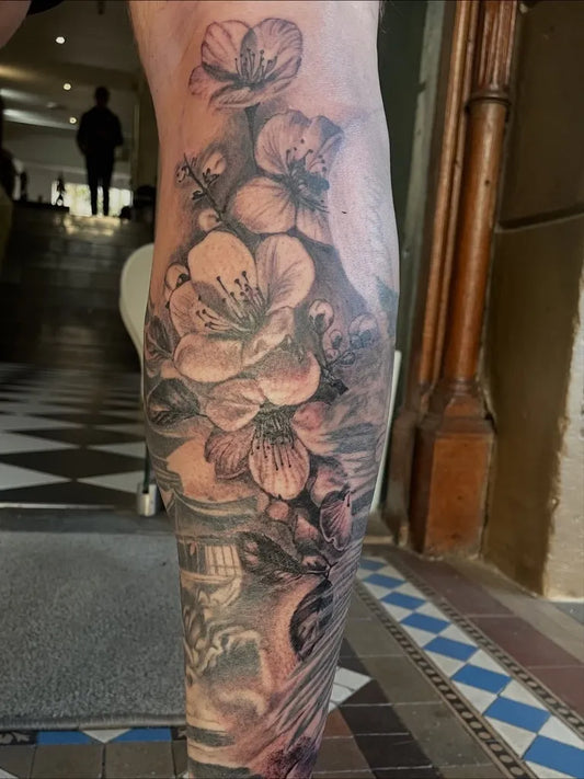 Big Black and Grey Cherry Blossom Flowers Bees on Women Leg Tattoo by @jordan_f_inked