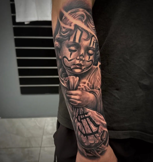 Big Black and Grey Cherub with Money Bag Tattoo on Men Arm by @robbotattoos