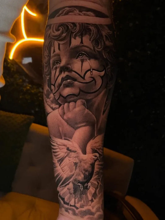 Big Black and Grey Cherub with Teardrops and Dove Tattoo on Men Arm by @jorgerosales_tattoos
