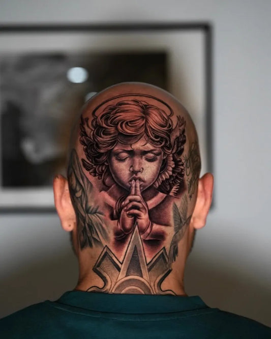 Big Black and Grey Cherub with Wings Tattoo on Men Head by @smileyartla