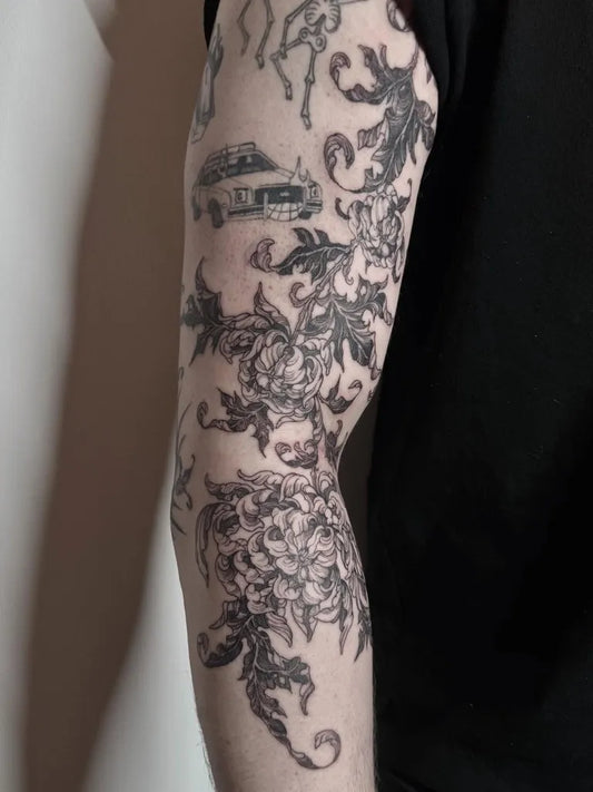 Big Black and Grey Chrysanthemum Car Tattoo on Men Arm by @moolymae