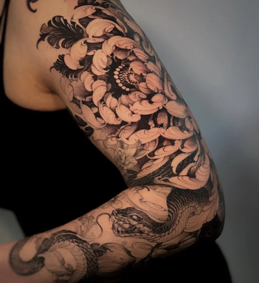 Big Black and Grey Chrysanthemum and Snake Tattoo on Women Arm by @d.x.m_tattooart