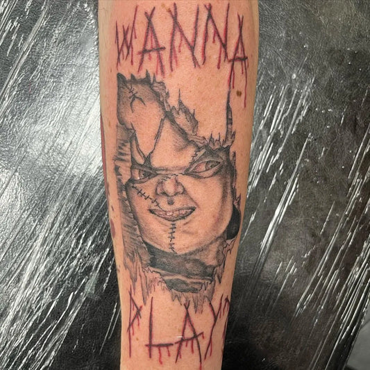 Big Black and Grey Chucky Doll Horror Tattoo on Men Arm by @fishink_tattoo