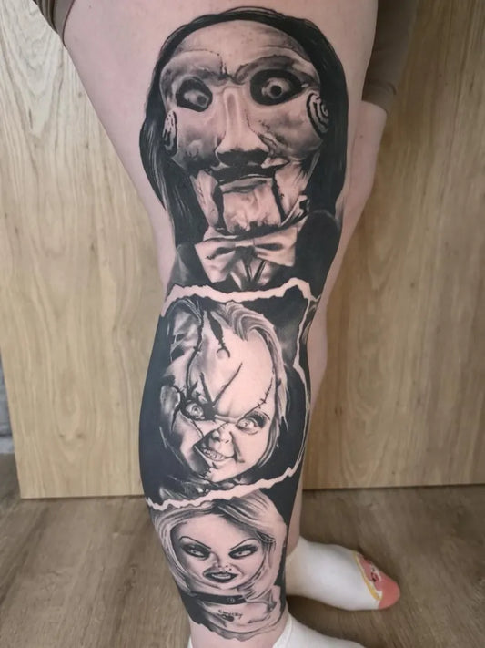 Big Black and Grey Chucky Family Horror Tattoo on Women Thigh by @egg_ink