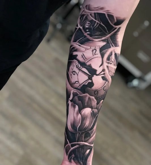 Big Black and Grey Clock and Tulip Tattoo on Men Arm by @marco_artistt
