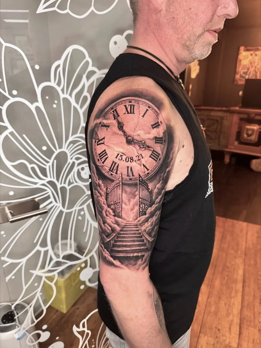 Big Black and Grey Clock with Stairs Tattoo on Men Shoulder by @thecultureshocks