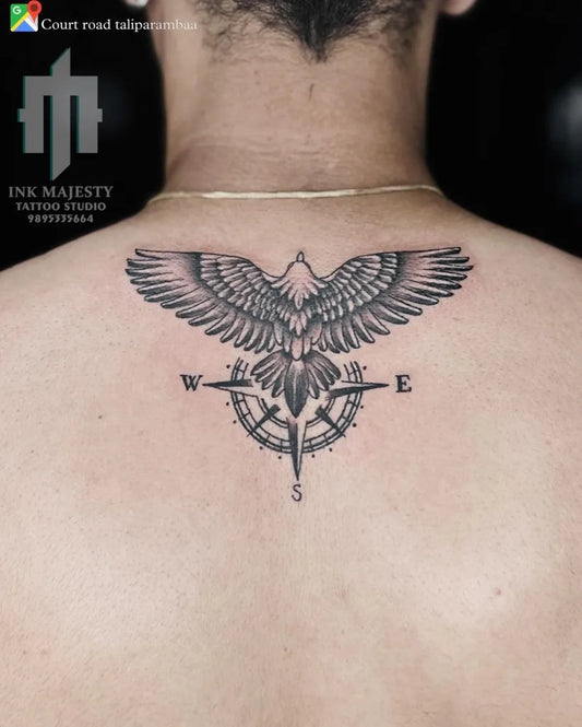 Big Black and Grey Compass Eagle on Men Back Tattoo by @tattoo_ink_majesty_taliparamba