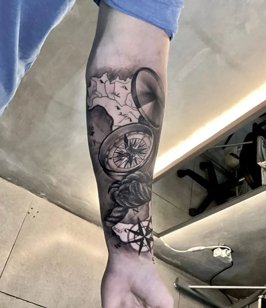 Big Black and Grey Compass Rose on Men Arm Tattoo by @evolve_tattoocanggu