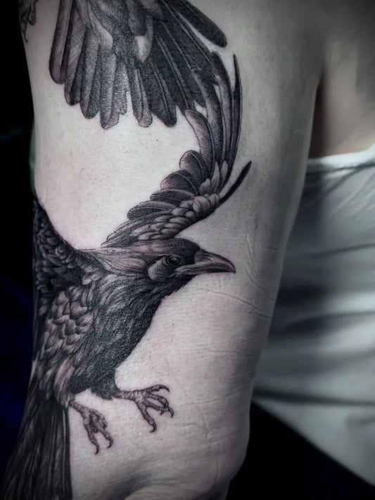 Big Black and Grey Crow Tattoo on Women Arm by @pensxneedles