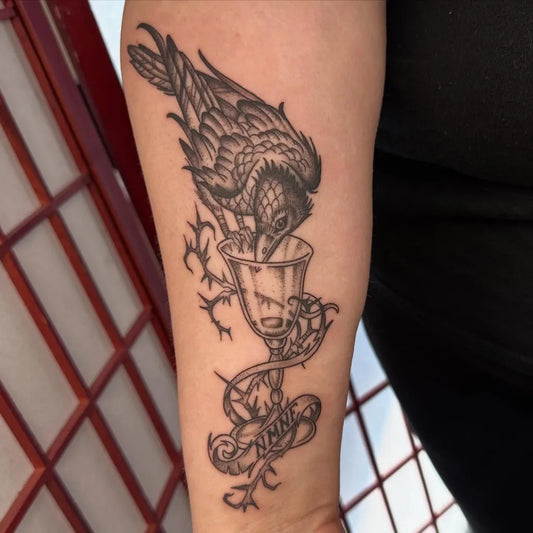 Big Black and Grey Crow with Chalice Tattoo on Women Arm by @nbrowntattoos637