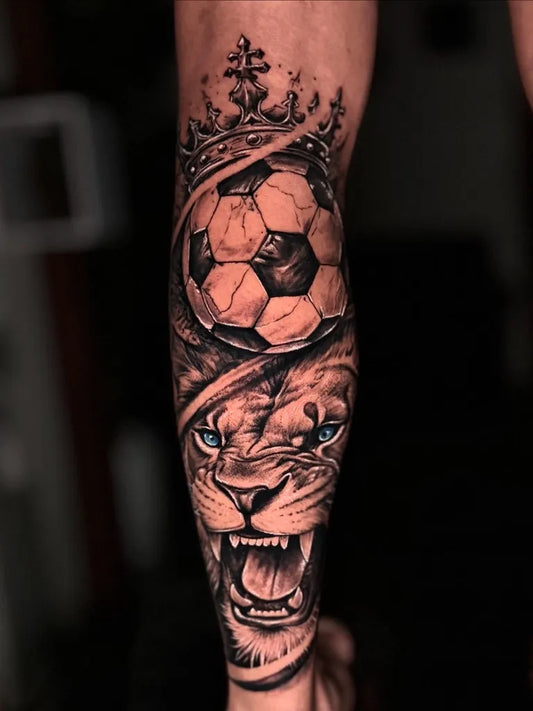 Big Black and Grey Crowned Lion Soccer Ball on Men Arm Tattoo by @harashtattoo_nepal