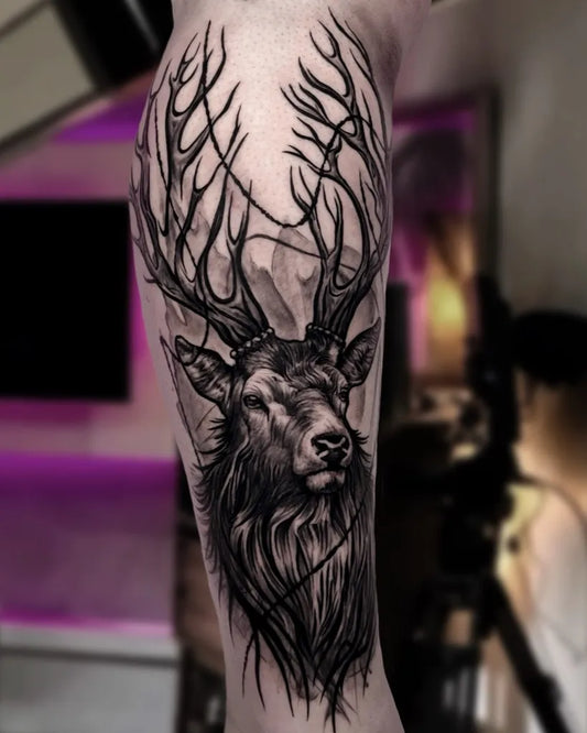 Big Black and Grey Deer Antlers Tattoo on Men Arm by @dio_tattoo