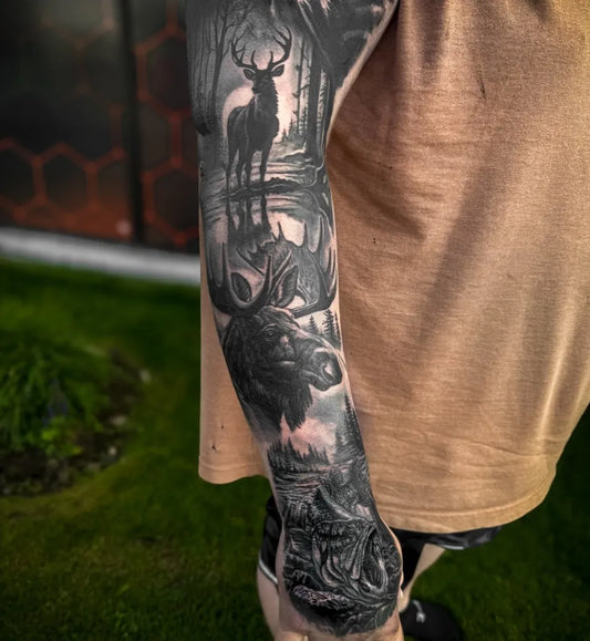 Big Black and Grey Deer Forest Moose Tattoo on Men Arm by @jbeaumont.tattoos