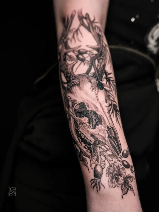 Big Black and Grey Deer Skull and Flowers Tattoo on Women Arm by @sofieneedles