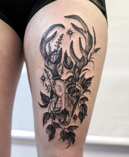 Big Black and Grey Deer Skull with Flowers and Stars Tattoo on Women Thigh by @littleferntattoo