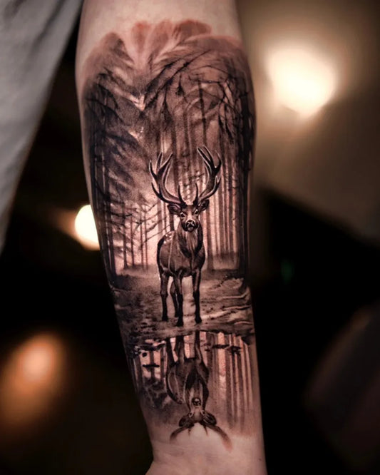 Big Black and Grey Deer in Forest Tattoo on Men Arm by @rebelsxrustlers.mechelen