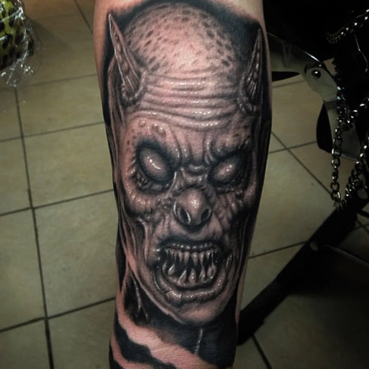 Big Black and Grey Demon Tattoo on Men Arm by @daveallentattoos