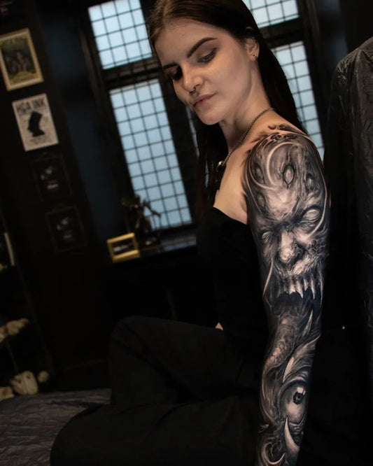 Big Black and Grey Demon Tattoo on Women Arm by @anders_grucz_tattoo
