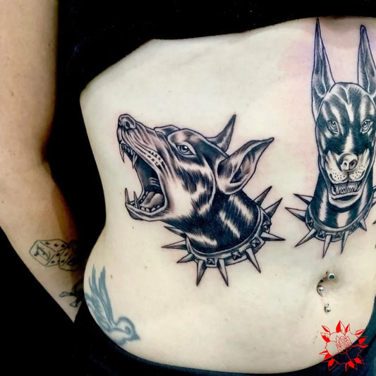 Big Black and Grey Doberman Head with Spiked Collar Tattoo on Women Stomach by @_skindeeptattoo