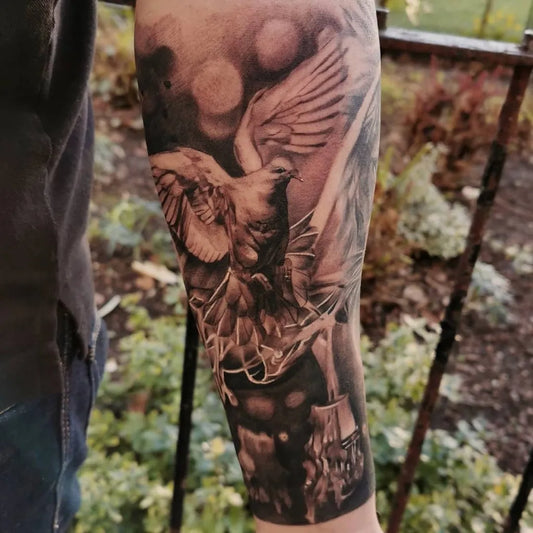 Big Black and Grey Dove Angel Tattoo on Men Arm by @g.kolev_tattoo