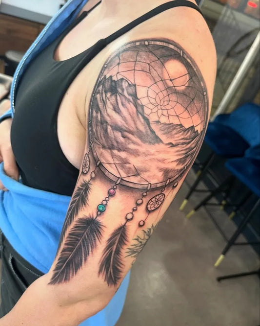 Big Black and Grey Dream Catcher Mountains Tattoo on Women Shoulder by @cameronhobbs_art