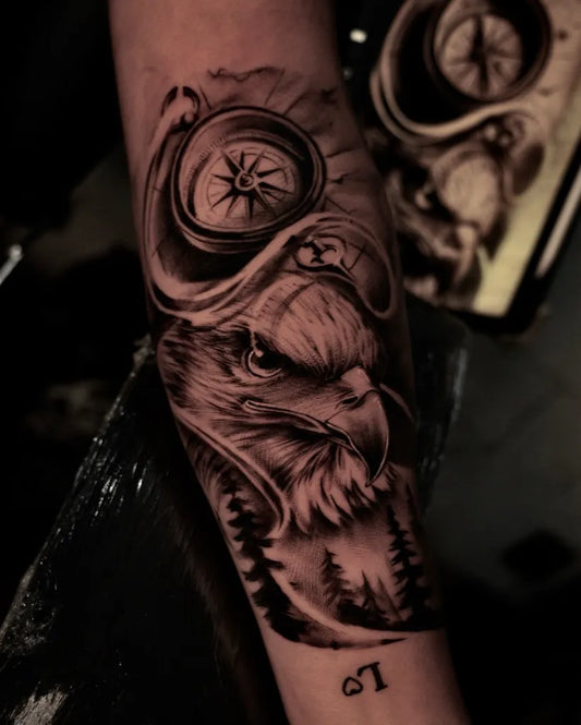 Big Black and Grey Eagle Compass Forest Tattoo on Men Arm by @_captain_ink