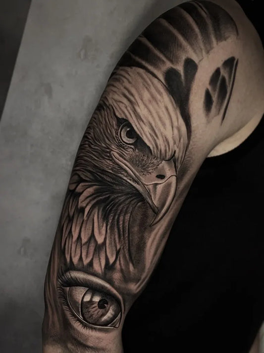 Big Black and Grey Eagle Eye Tattoo on Men Arm by @marquez.inkart