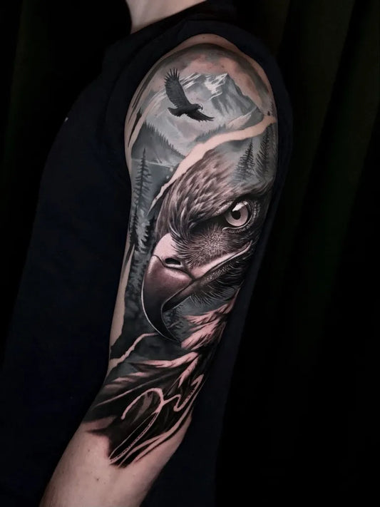 Big Black and Grey Eagle Landscape Tattoo on Men Arm by @ziga_tattoo