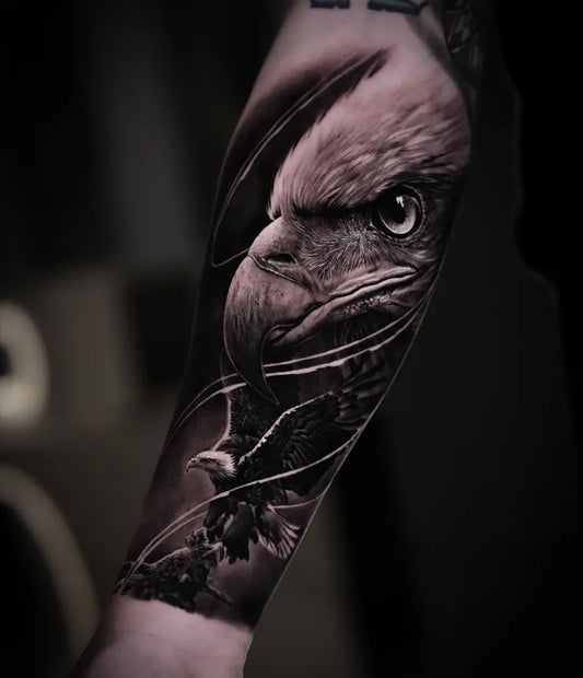 Big Black and Grey Eagle with Feathers and Branches Tattoo on Men Arm by @victormane_tattoo