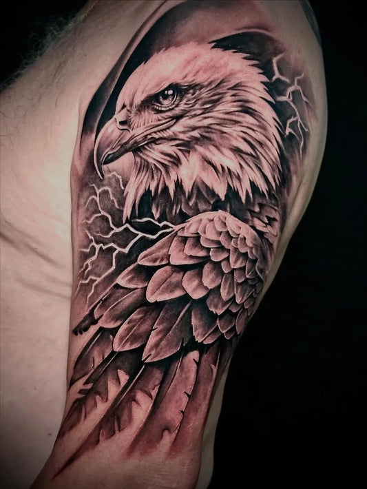 Big Black and Grey Eagle with Lightning Tattoo on Men Arm by @liberty_ink_tattoo