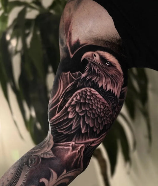 Big Black and Grey Eagle with Mountains Tattoo on Men Arm by @kyledevriesink